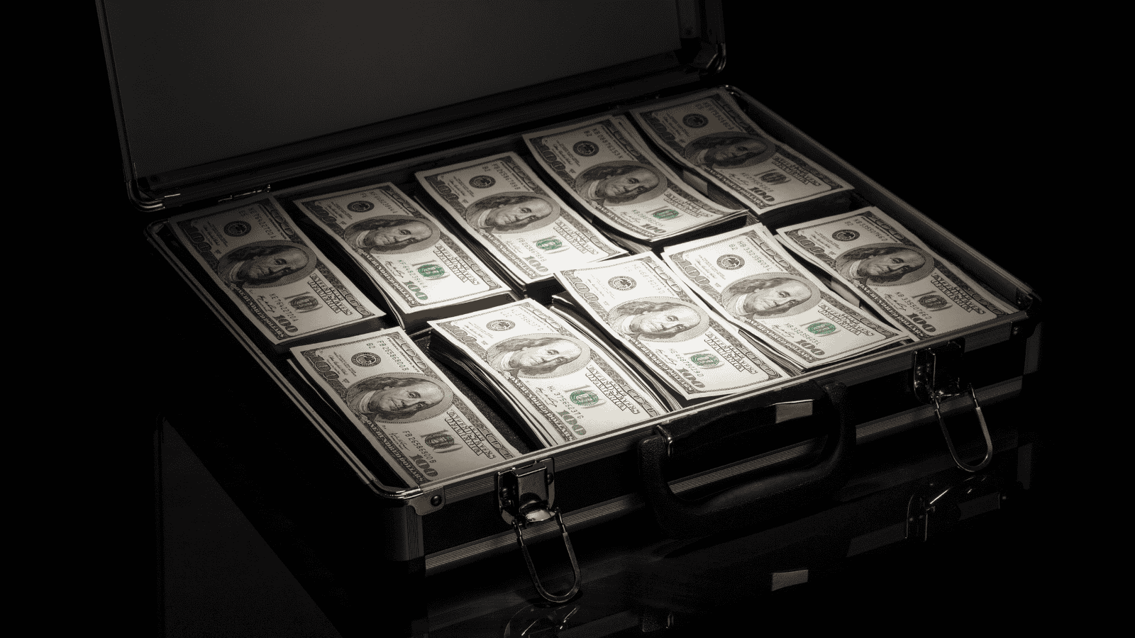a photograph of a briefcase full of money