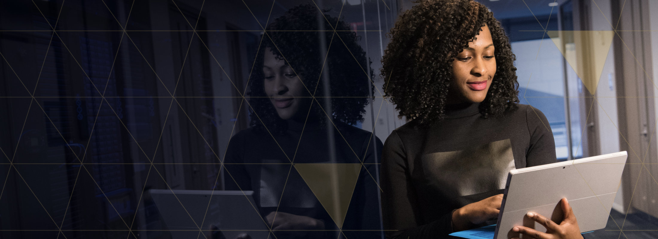 A woman reviews the cyber security status from her laptop