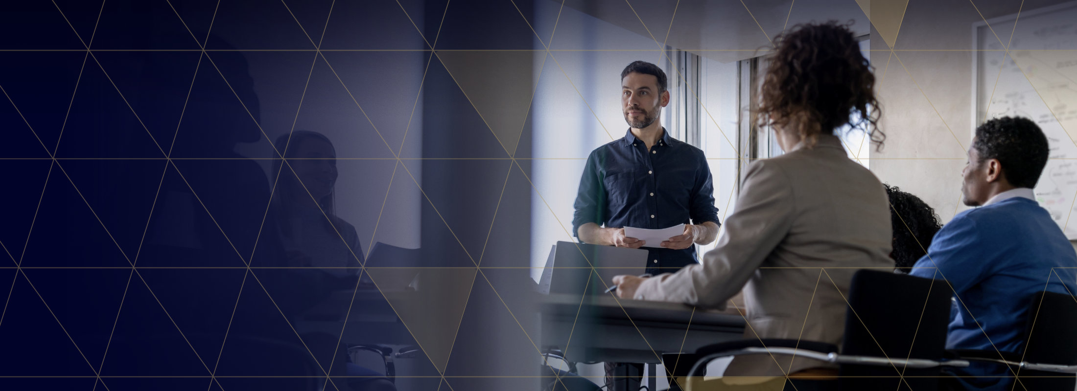 A business man leading a discussion in a conference room