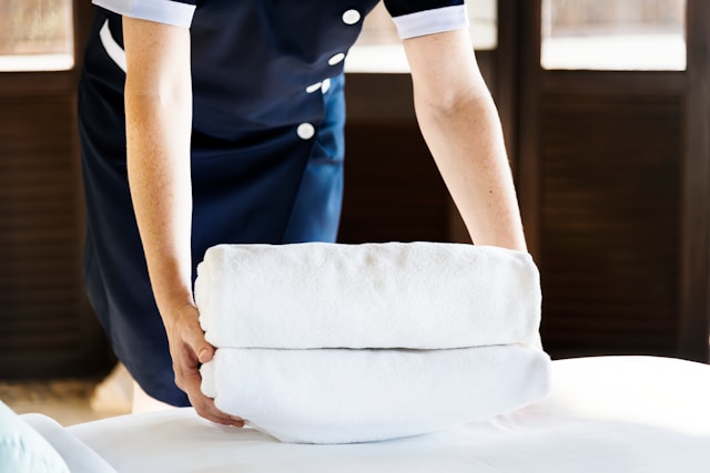 Executive Housekeeper folding towels