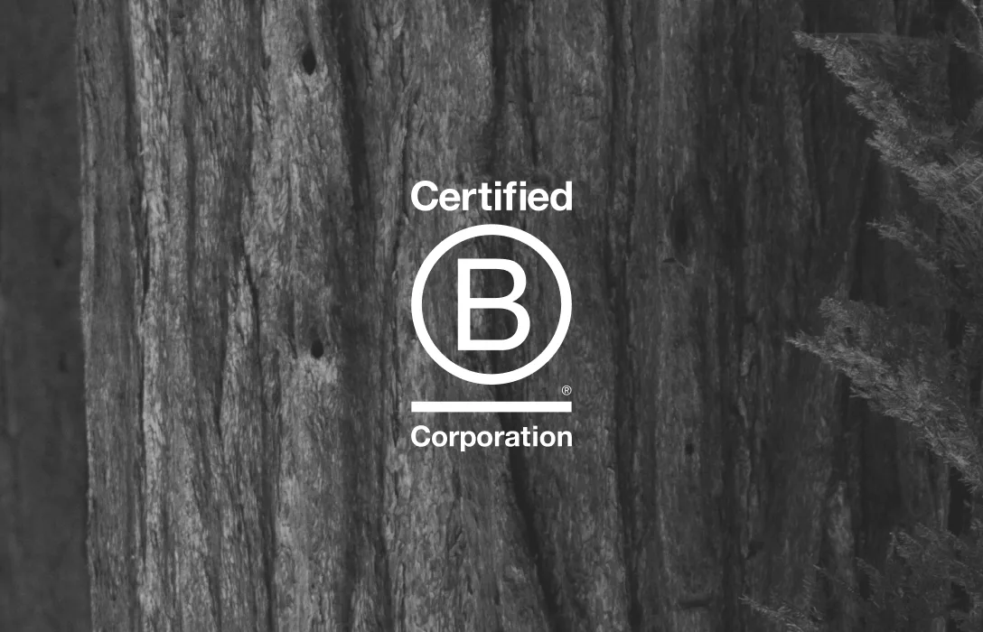Certified B Corporation mark over a timber texture