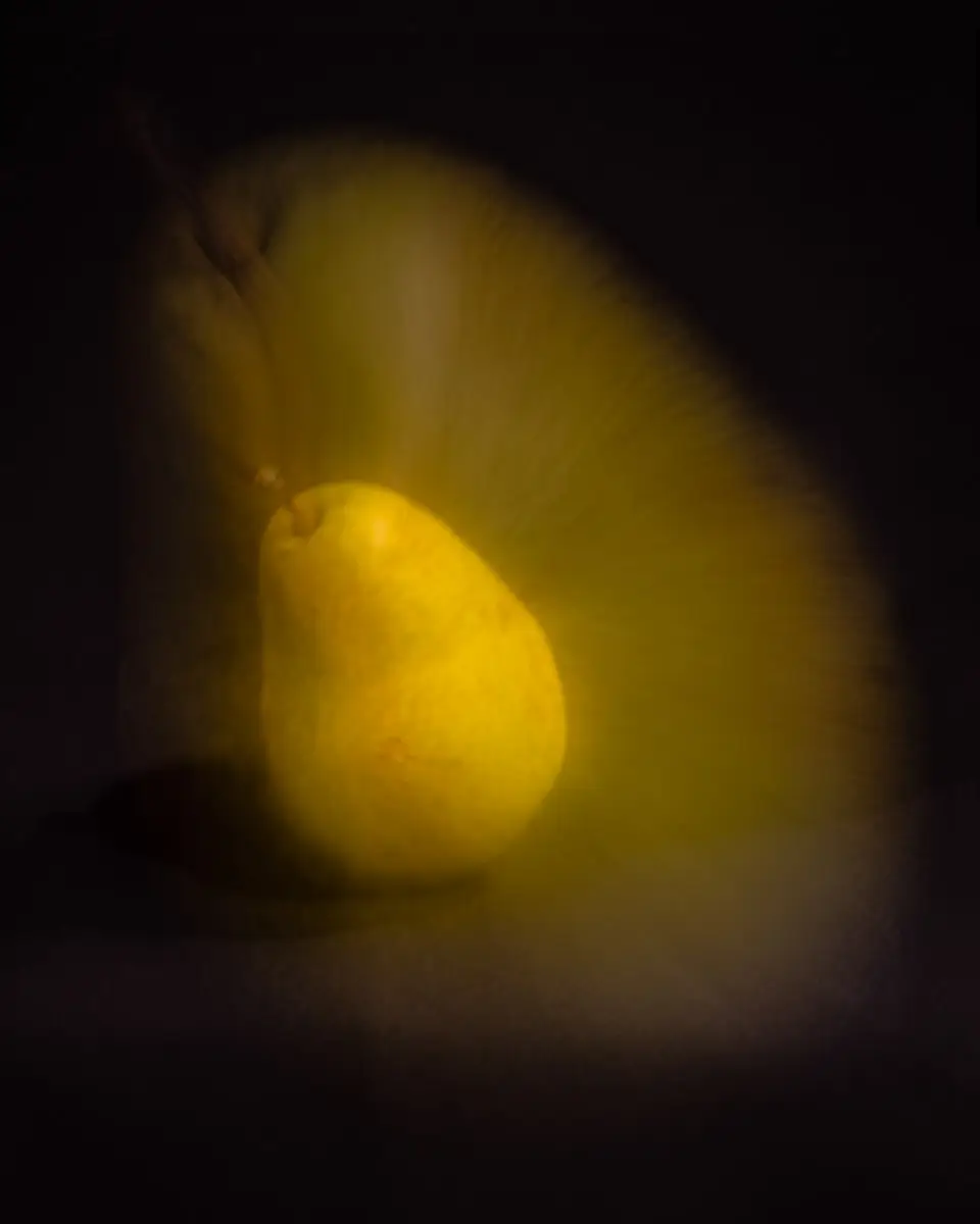 zooming while shooting created an aura around the single pear