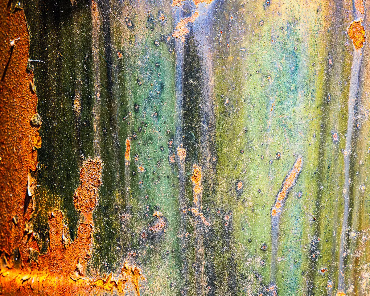 close up of rust on an old car, looks like a forest