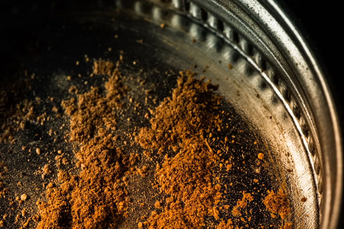 macro shot of cinnamon in the jar cap