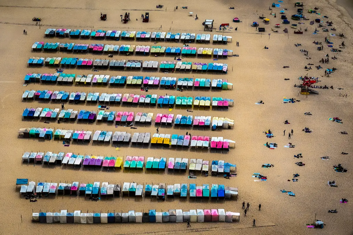 Portugal: pattern of colorful chaise lounges on a beach