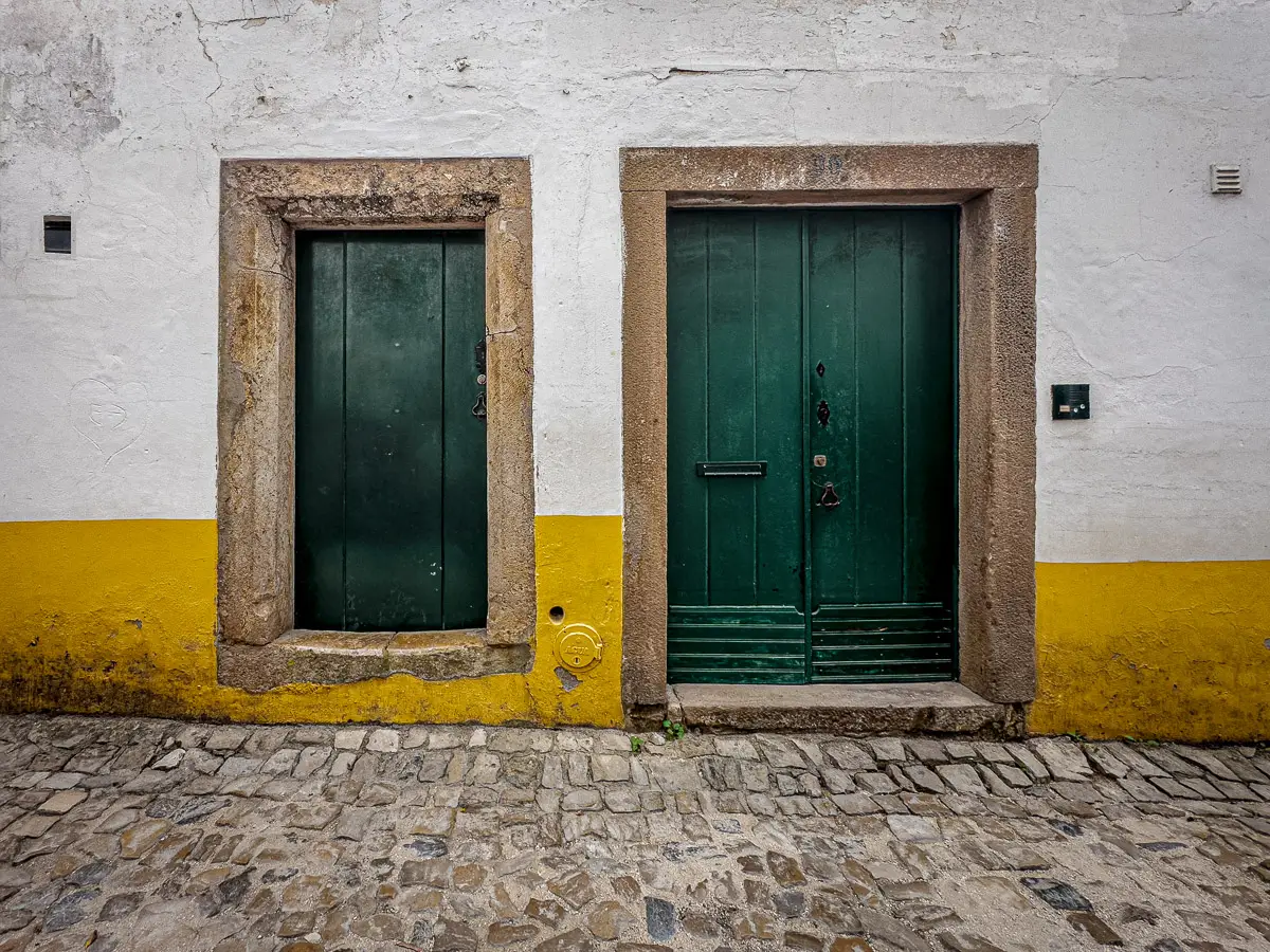 Portugal: green doors of different sizes