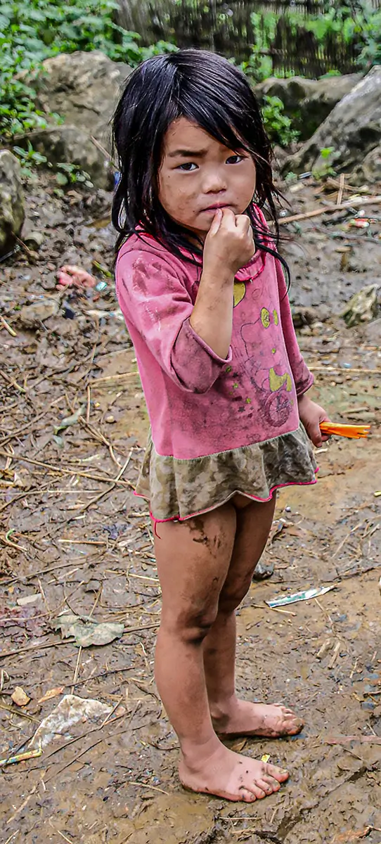 Vietnam: barefoot girl in a mountain village