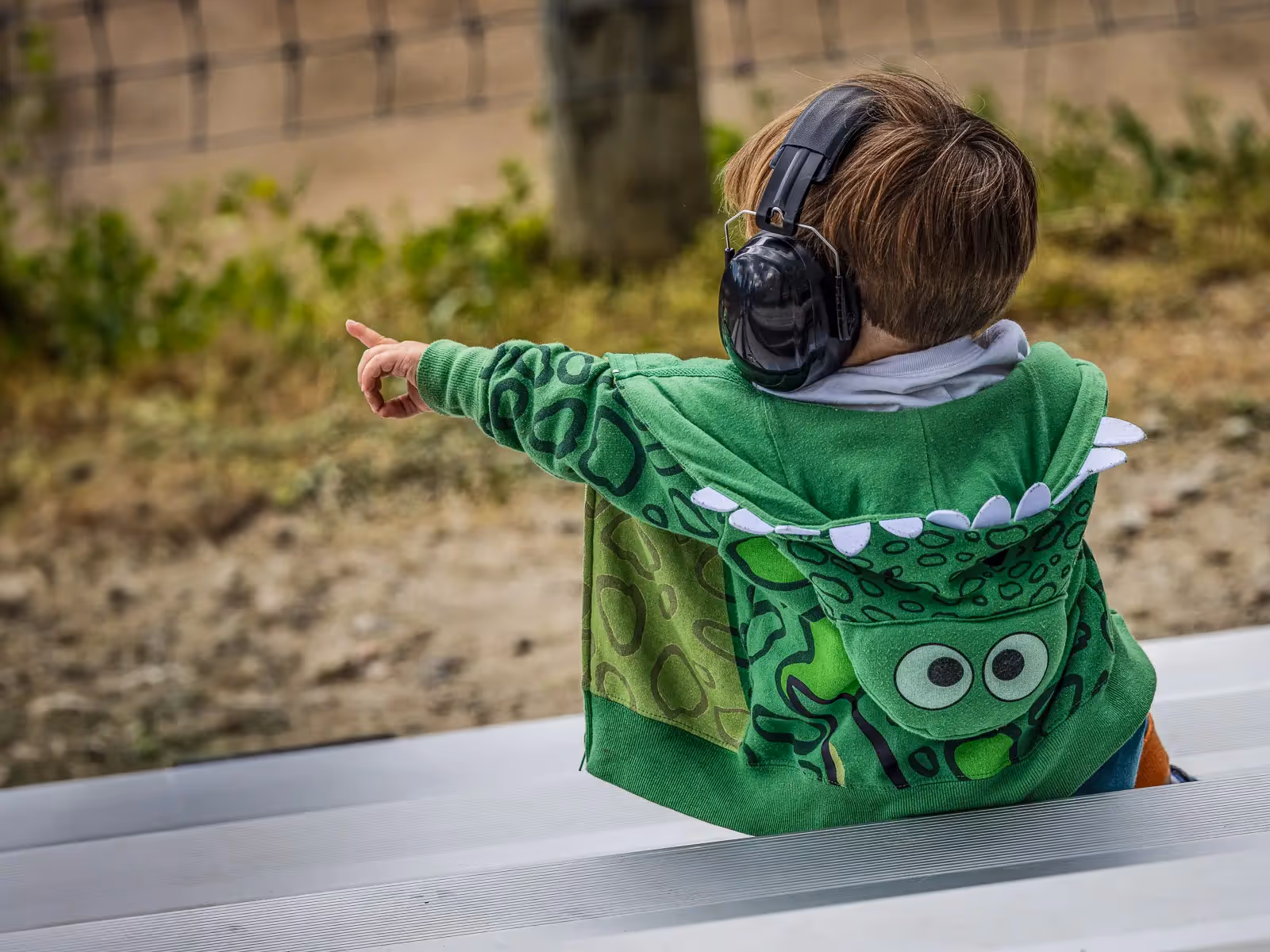 Goshen NY Rodeo: boy watching monster truck with headphones