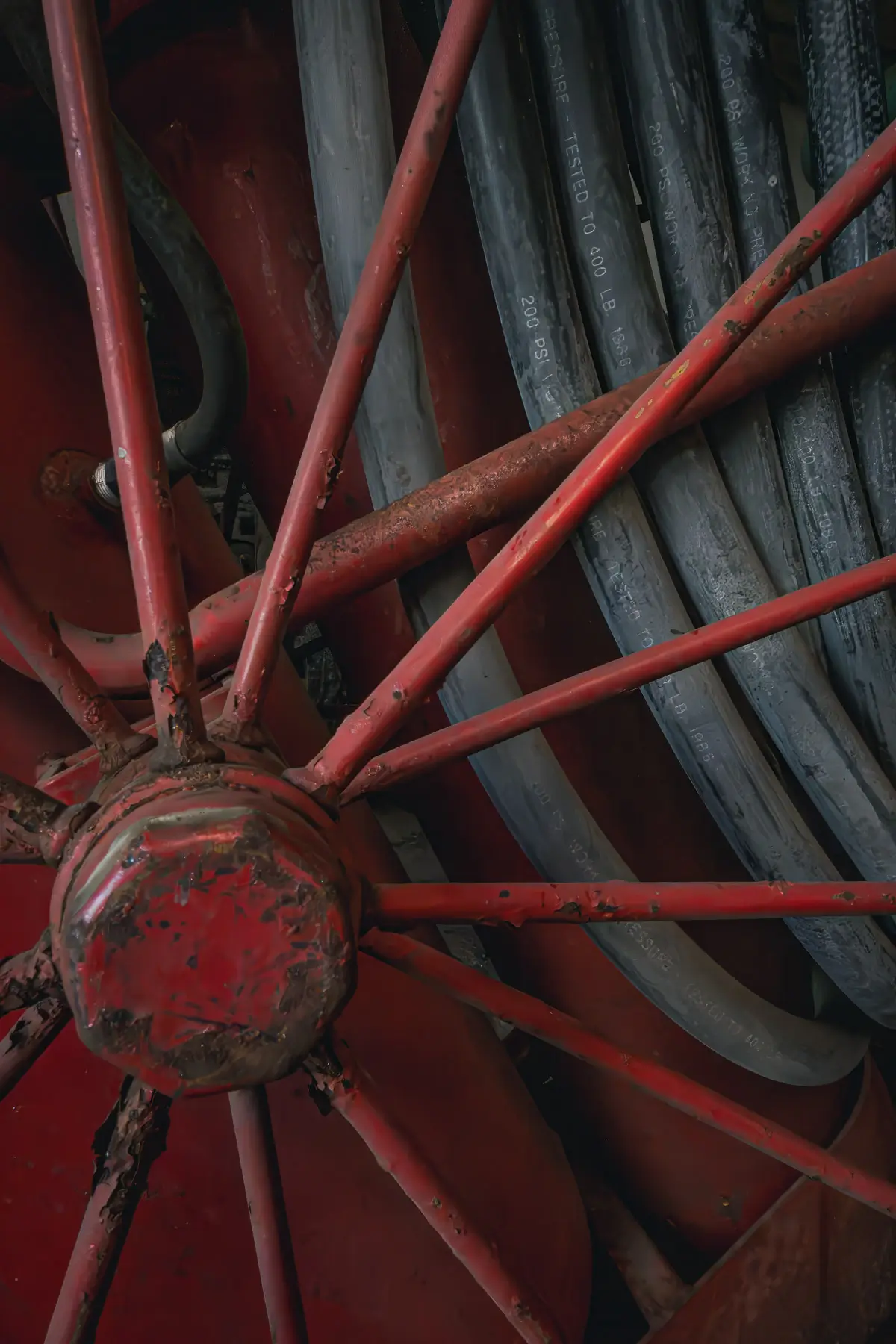 Manresa Island Power Plant: abstact, rust, peeling paint, shadows, light, wheel spokes and hose