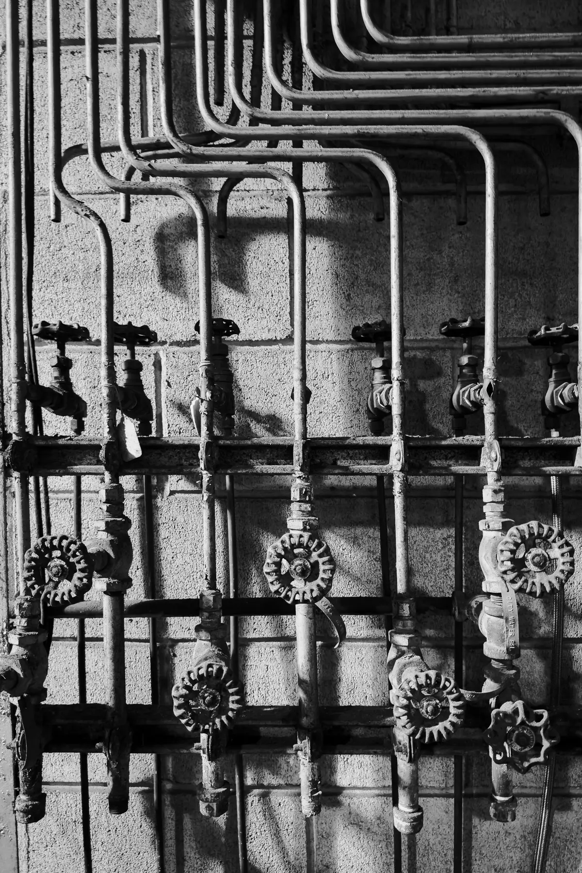 Manresa Island Power Plant: abstact, rust, peeling paint, shadows, light, pipes and knobs