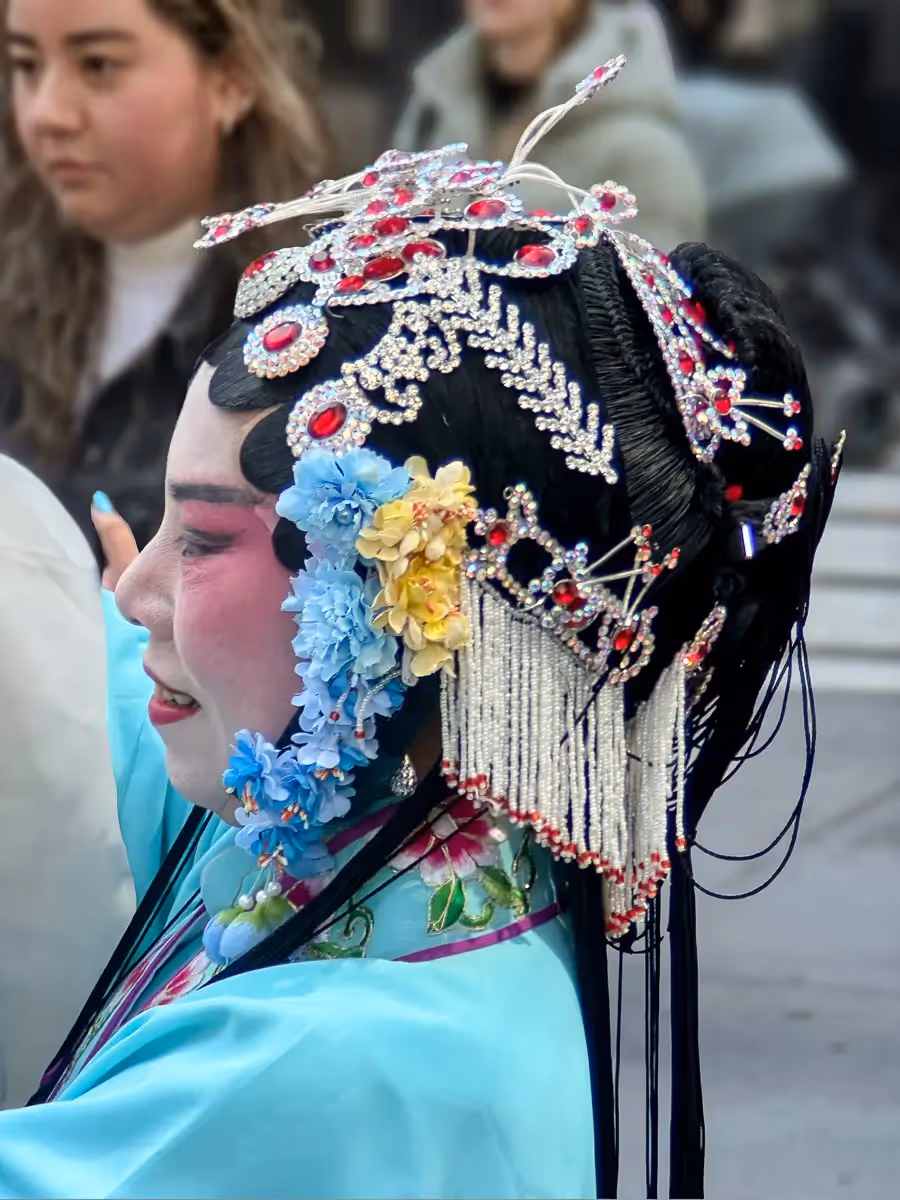 2024 Easter Bonnet Parade, NYC: lace and beaded cap wiht long strands of hair.