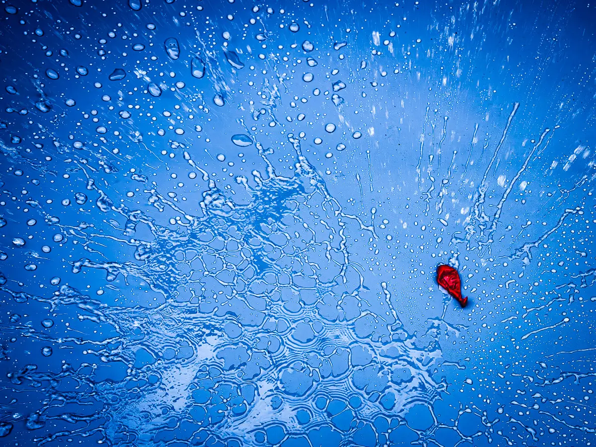 splattered water around crashed water balloon