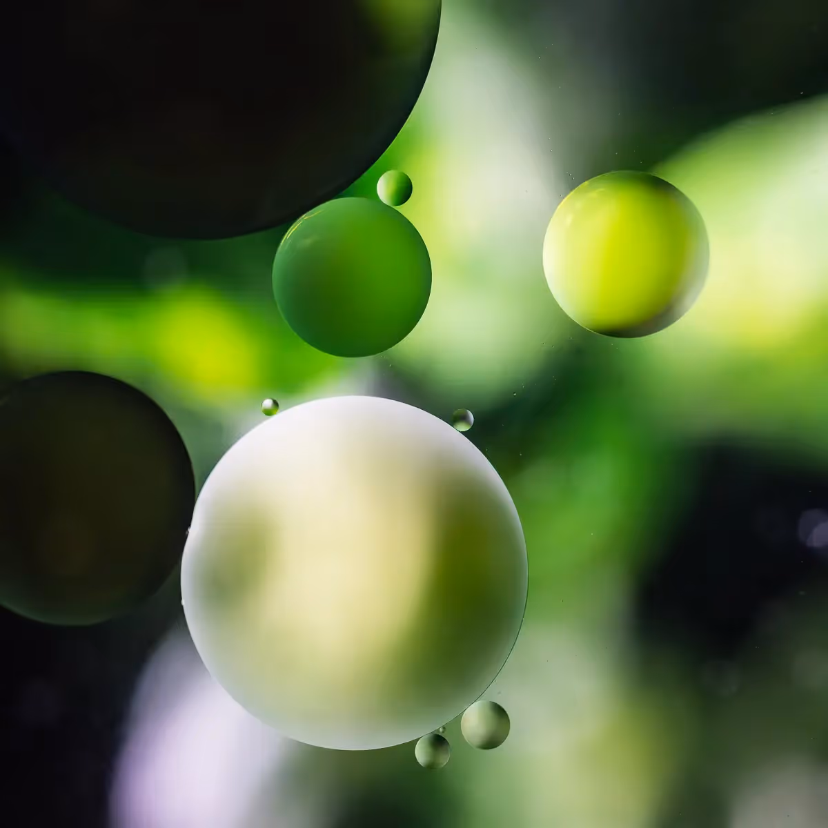 Immiscible: abstract of oil and water with a colorful background. Green