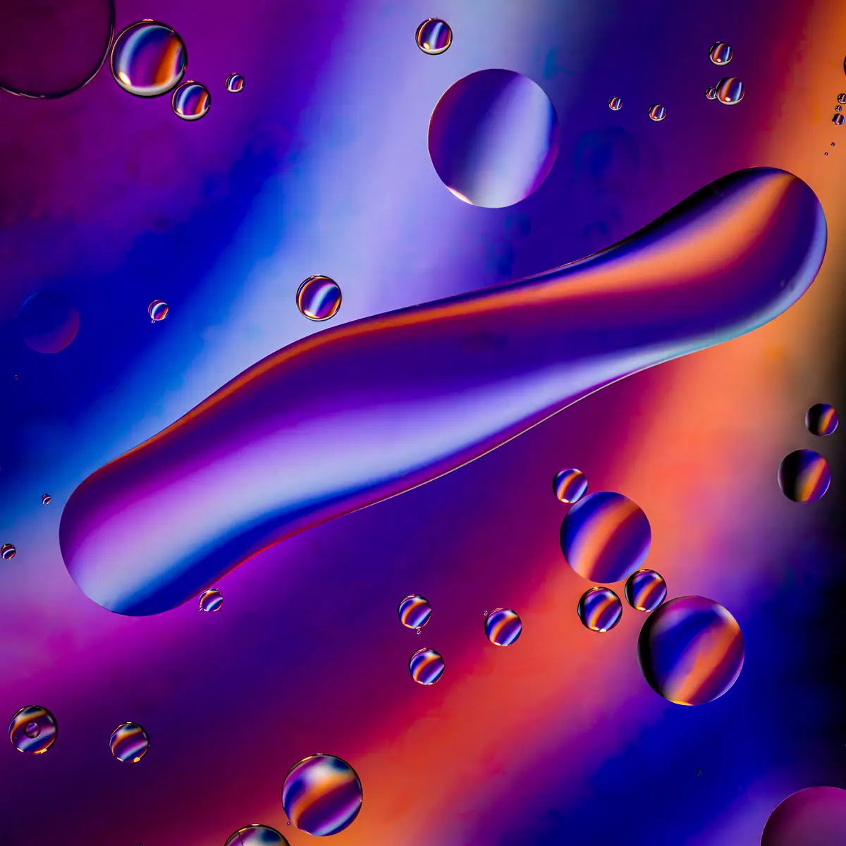 Immiscible: abstract of oil and water with a colorful background. 