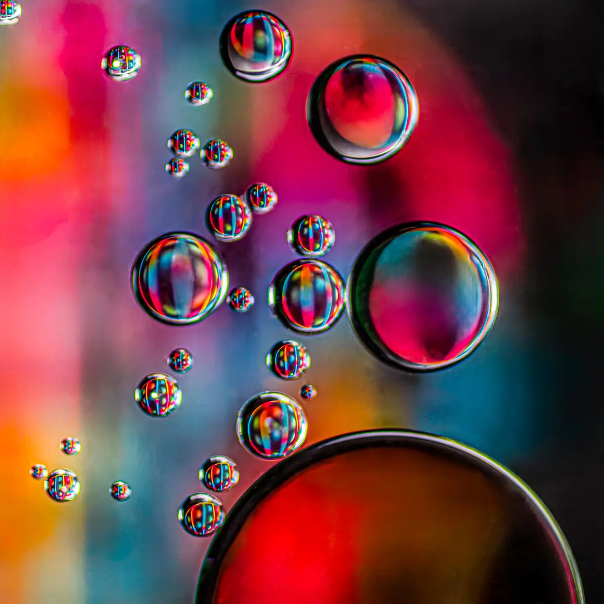 Immiscible: abstract of oil and water with a colorful background. 