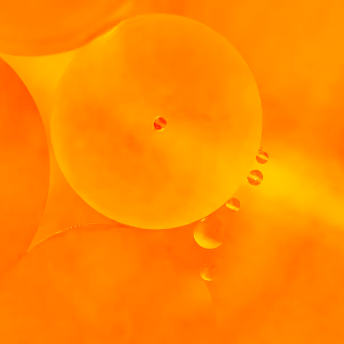 Immiscible: abstract of oil and water with a colorful background. Orange