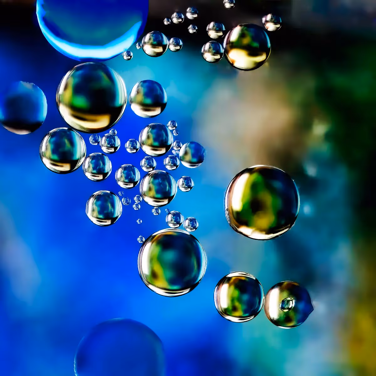 Immiscible: abstract of oil and water with a colorful background.  Planetary