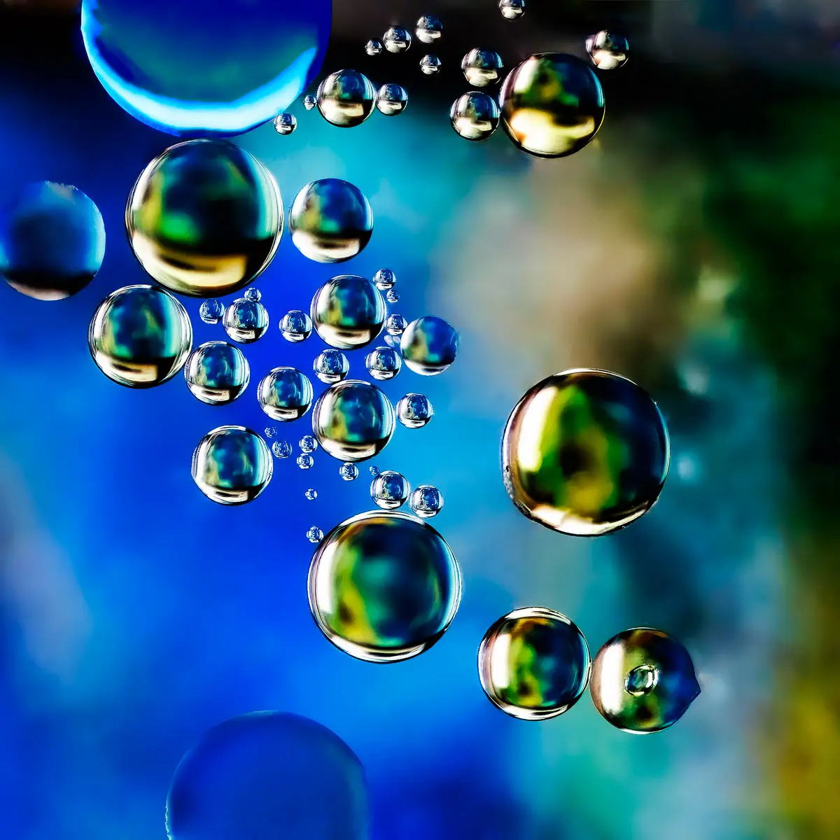 Immiscible: abstract of oil and water with a colorful background.  Planetary