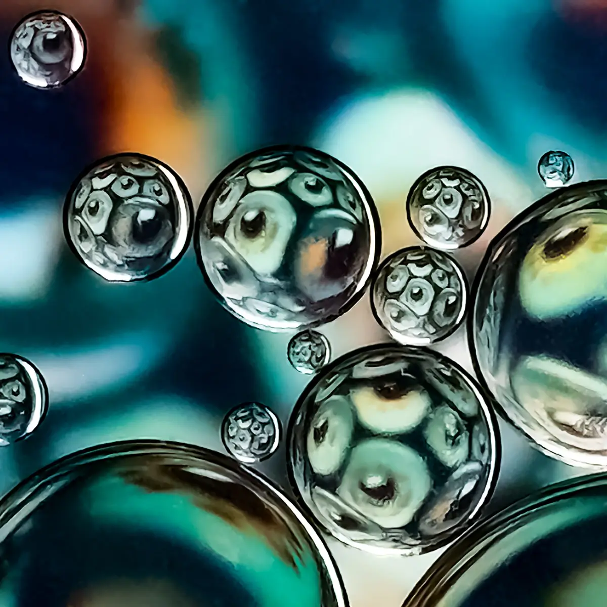 Immiscible: abstract of oil and water with a colorful background.  eyeballs