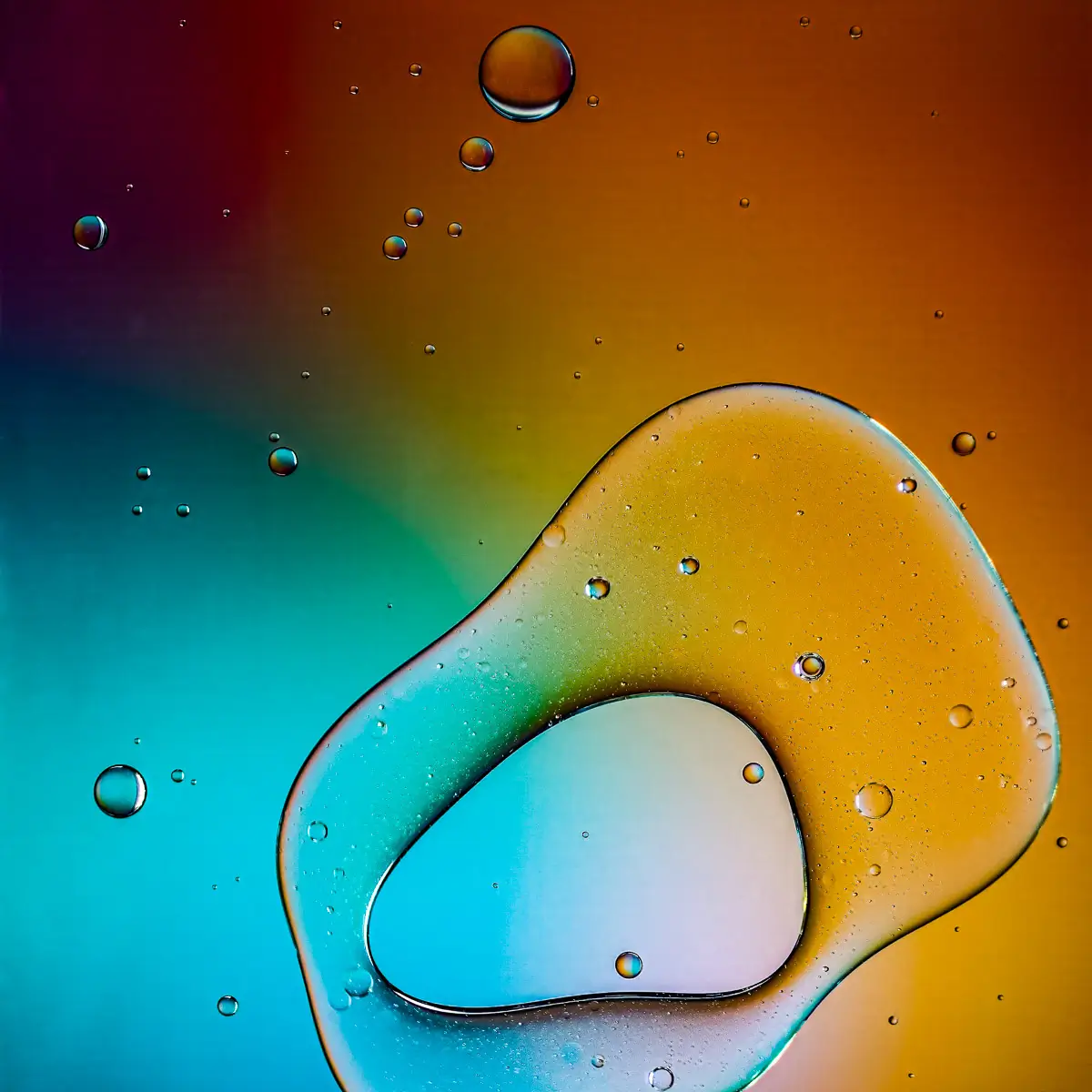 Immiscible: abstract of oil and water with a colorful background. 