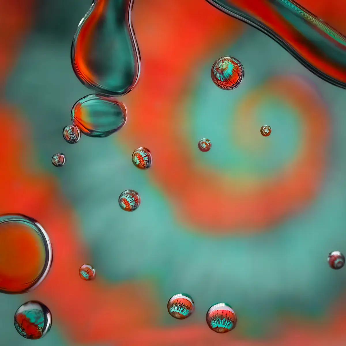 Immiscible: abstract of oil and water with a colorful background.  Blue and Red swirl
