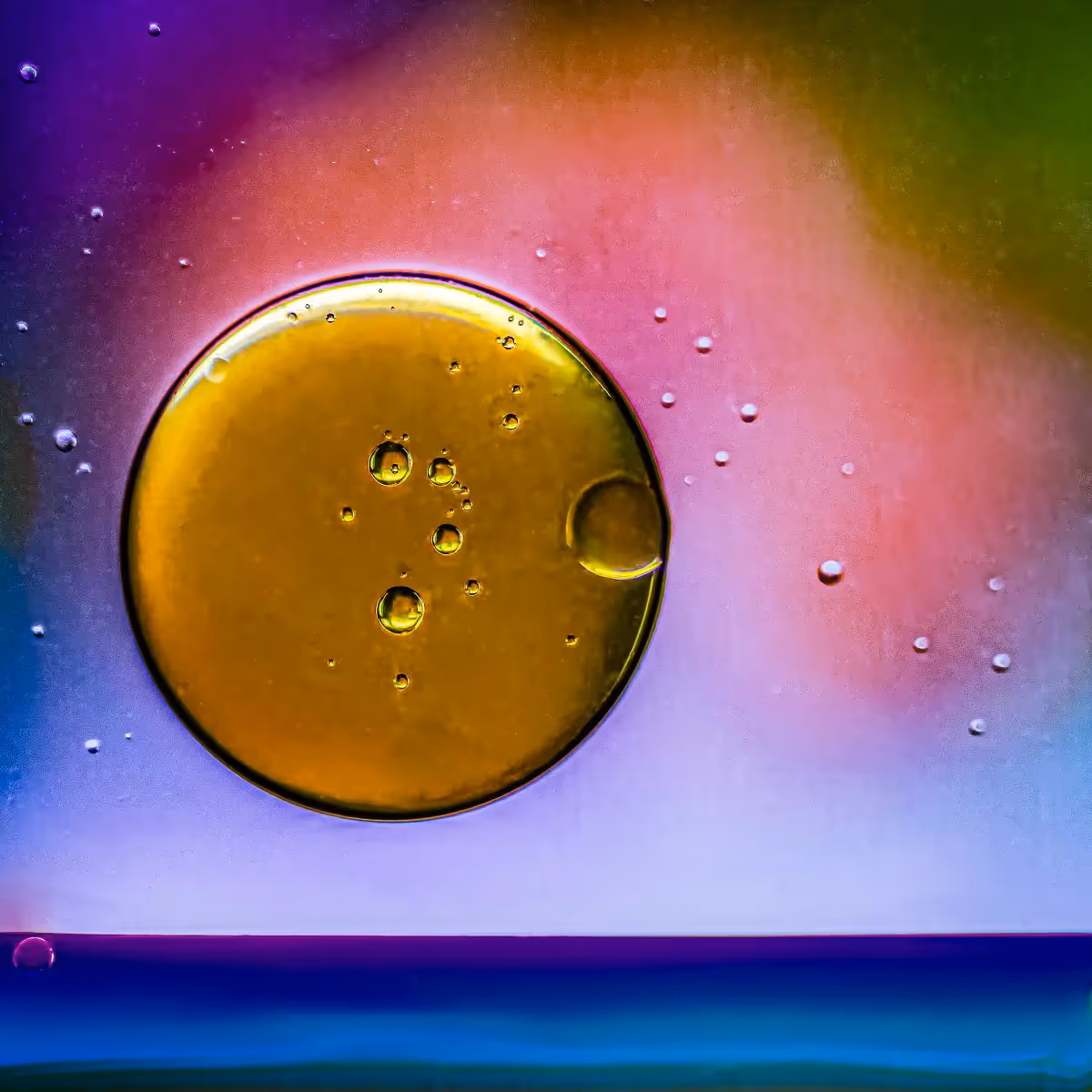Immiscible: abstract of oil and water with a colorful background. 