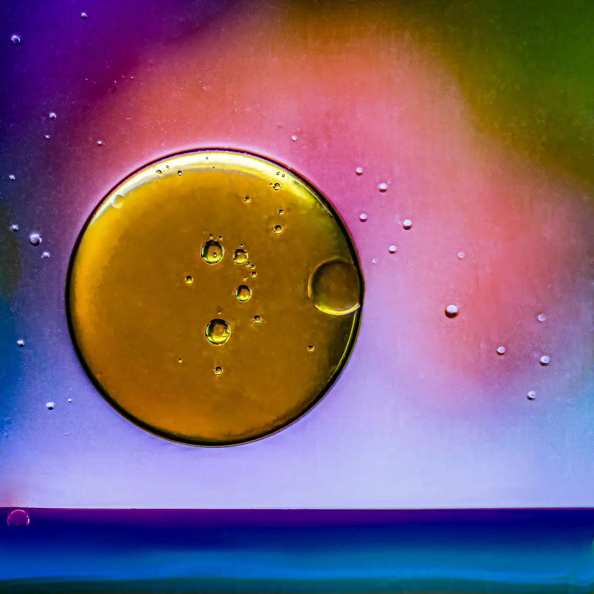 Immiscible: abstract of oil and water with a colorful background. 