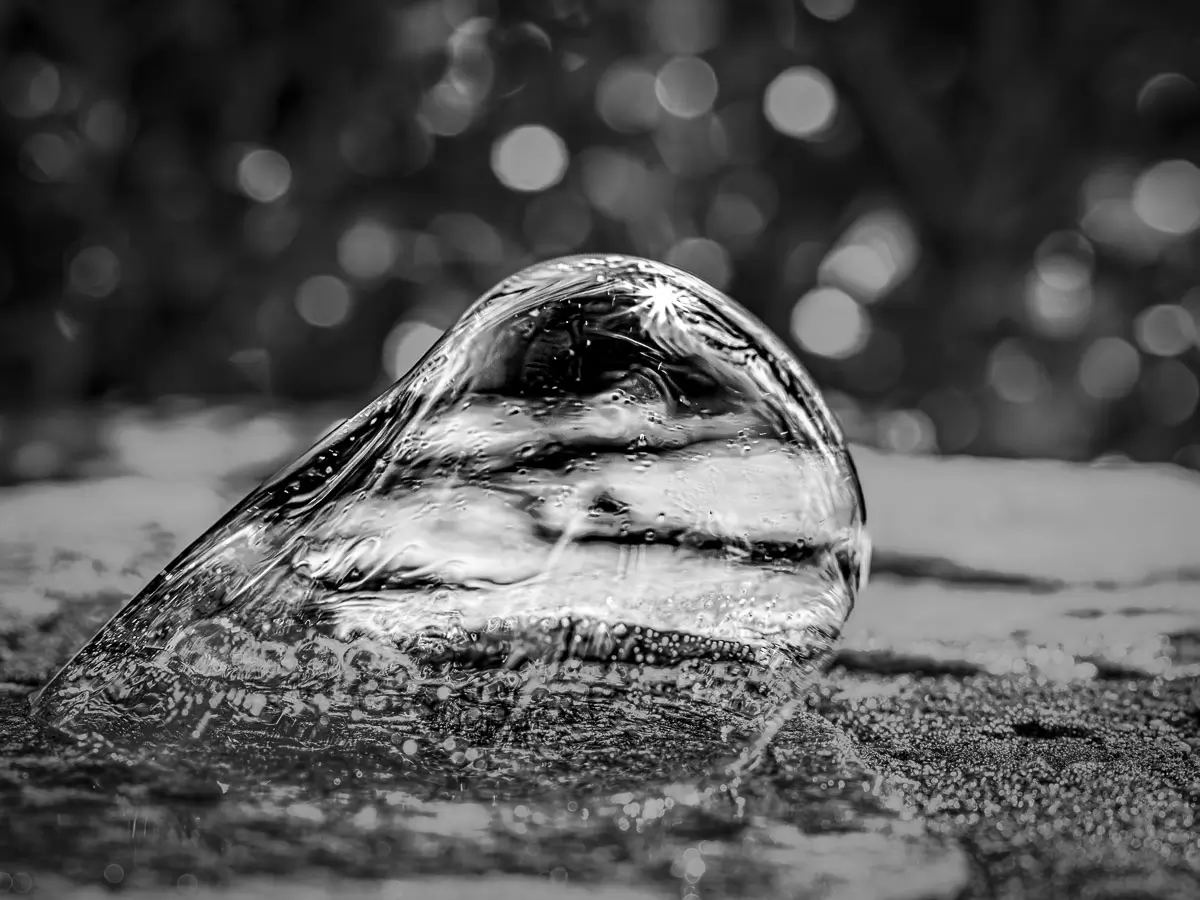 soap bubble in black and white, about to float away