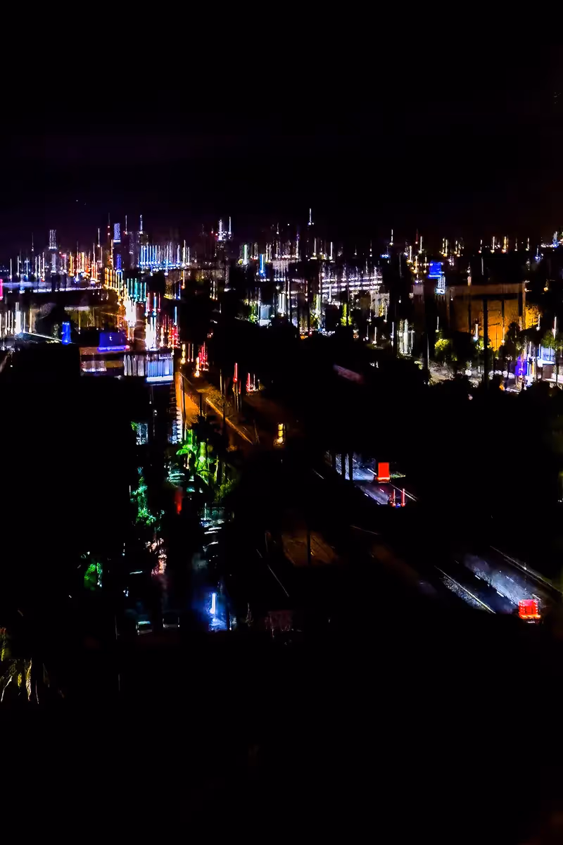 Colorful lights blurred by intentional camera movement in the blackness of nighttime Miaimi