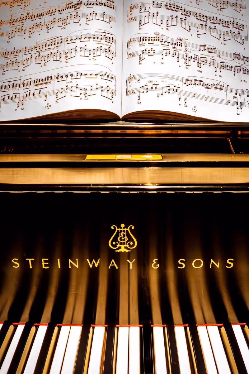 Close up of piano keys and music