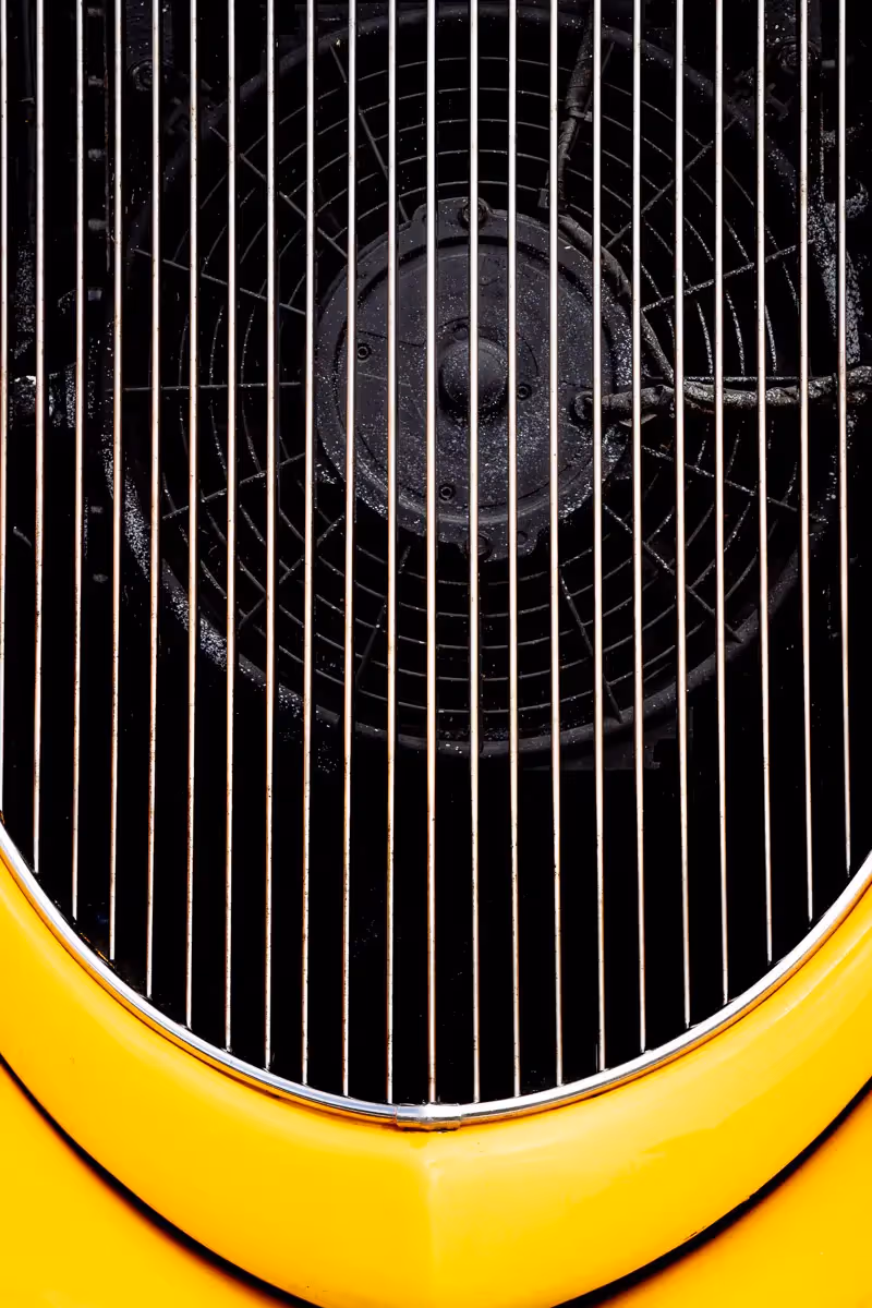 Norwalk, CT car show: through the front vent of a bright yellow car