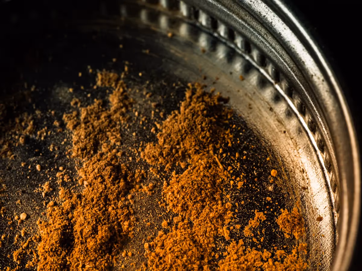 macro shot of cinnamon in the jar cap