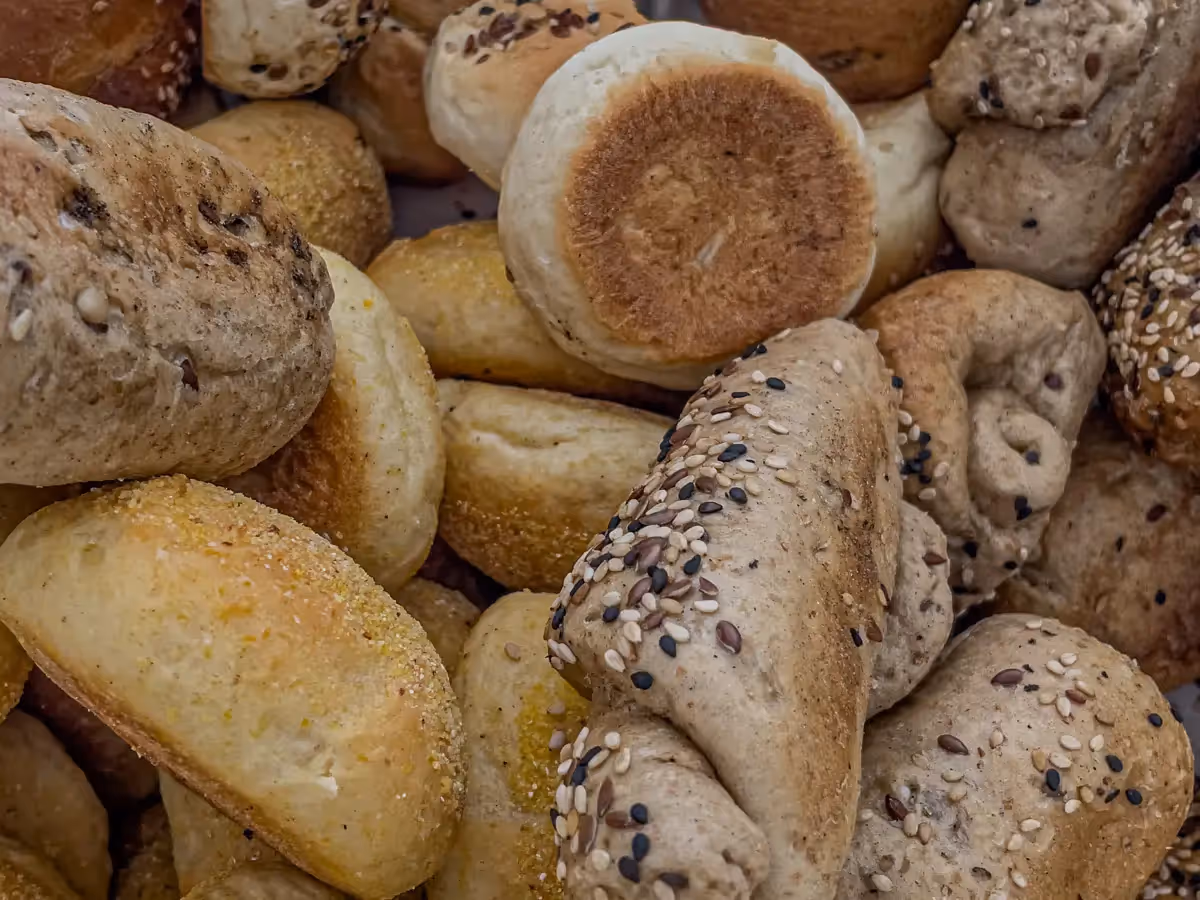 close up of a pile of bread rolls in different shapes and sizes