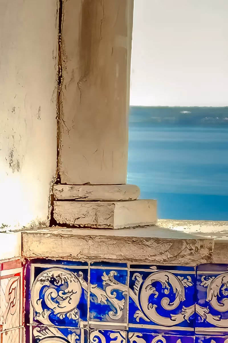 Portugal, looking out a corner to the sea with tiled walls and stone column