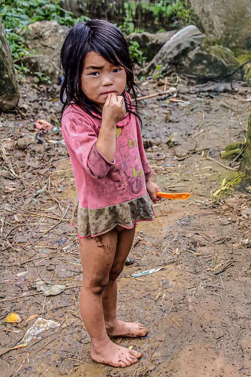 Vietnam: barefoot girl in a mountain village