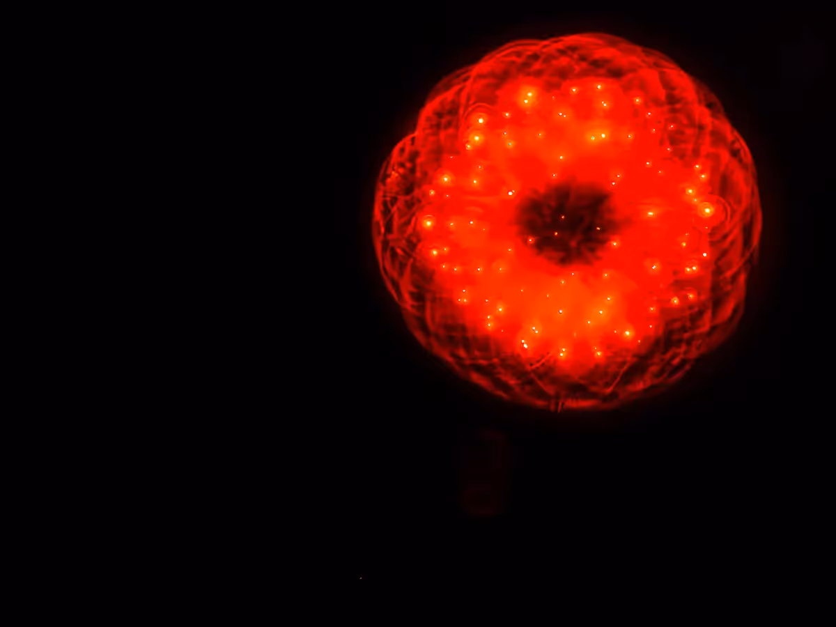 Abstract fireworks: bright red, delicate looking doily 