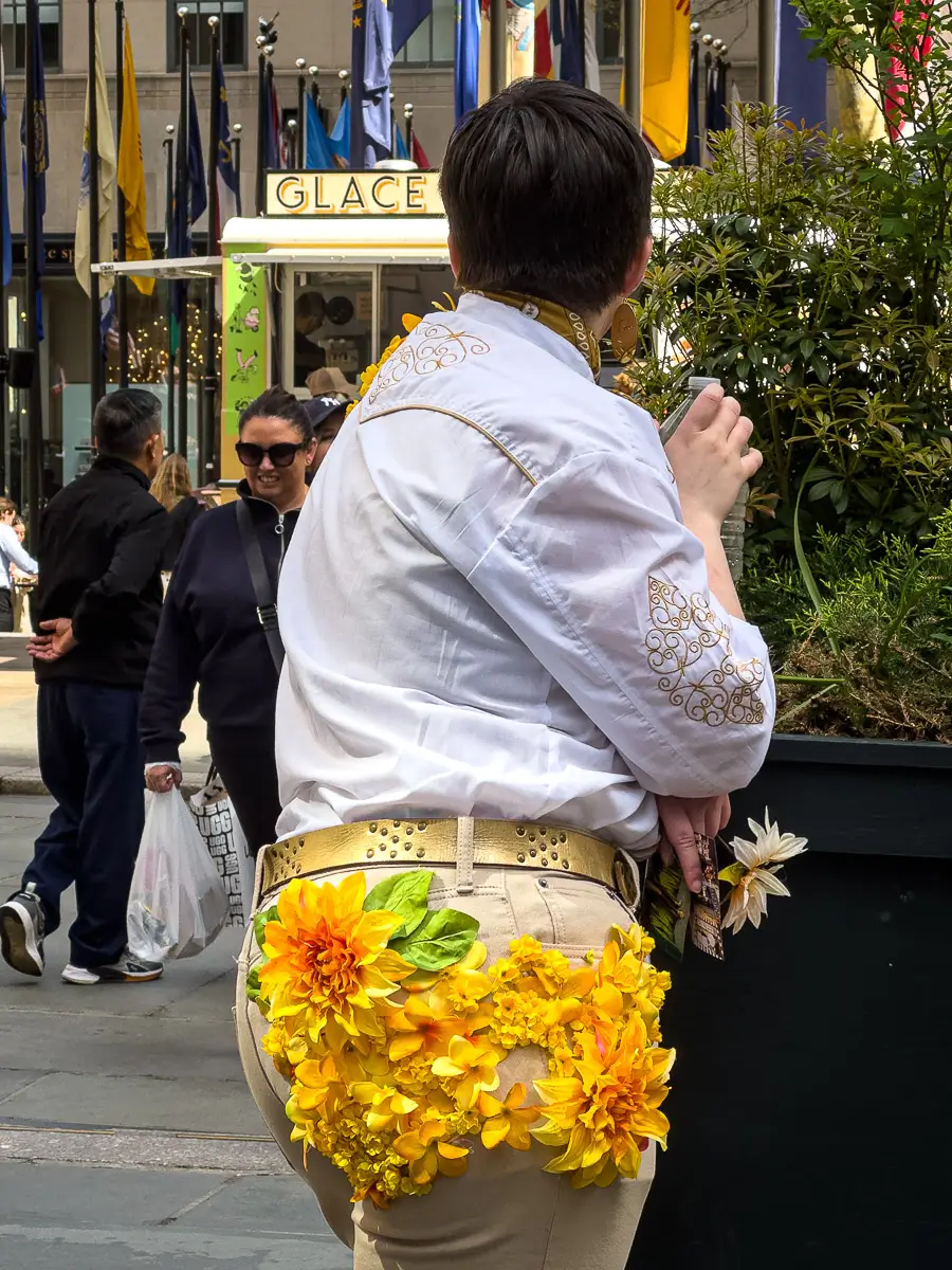 NYC Easter Bonnet Parade: Man with flower arrangement on his back side