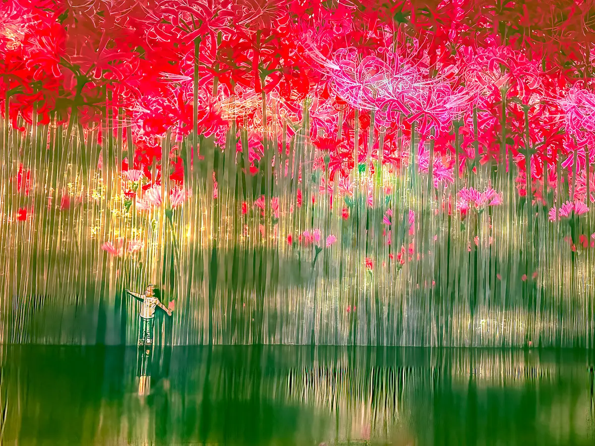 LIttle girl dancing in front of blooming flower projection in a museum in Miami