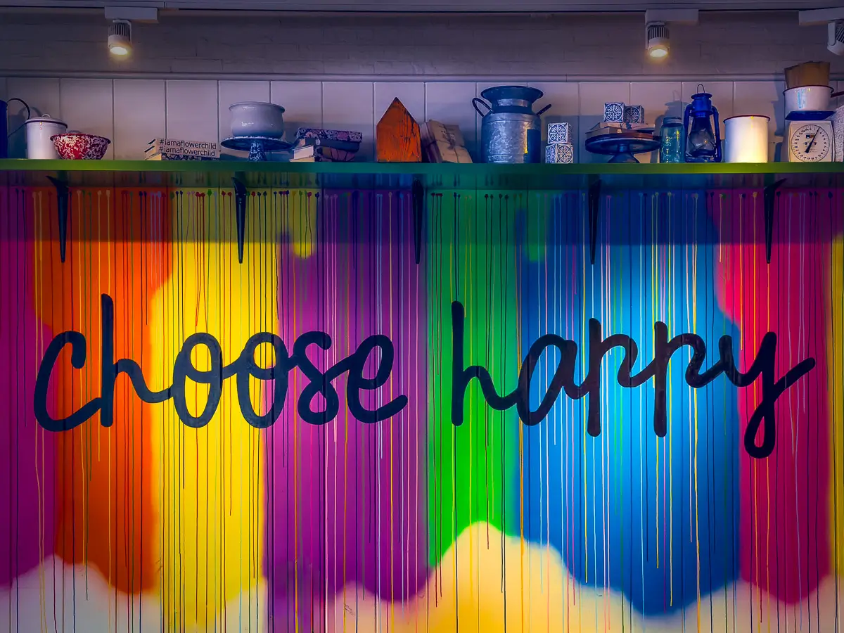 Colorful wall in a restaurant in Atlanta that says "Choose Happy"