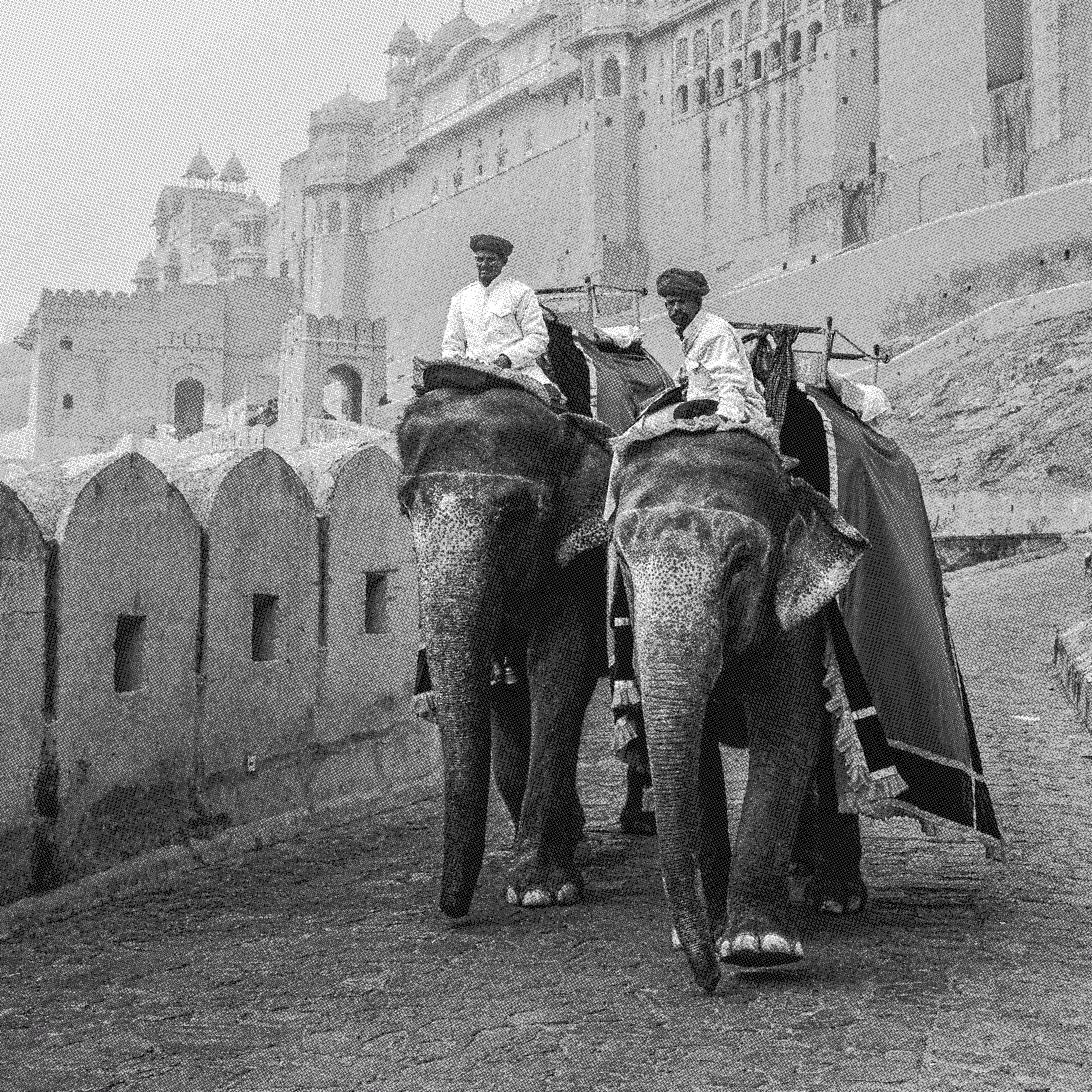 Two men riding elephants