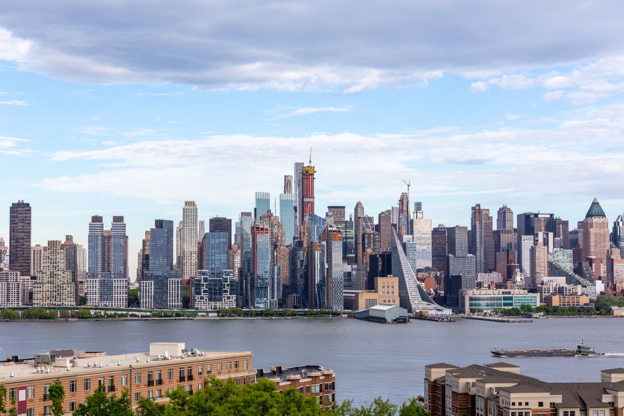 City skyline across the river seen from an Aker community