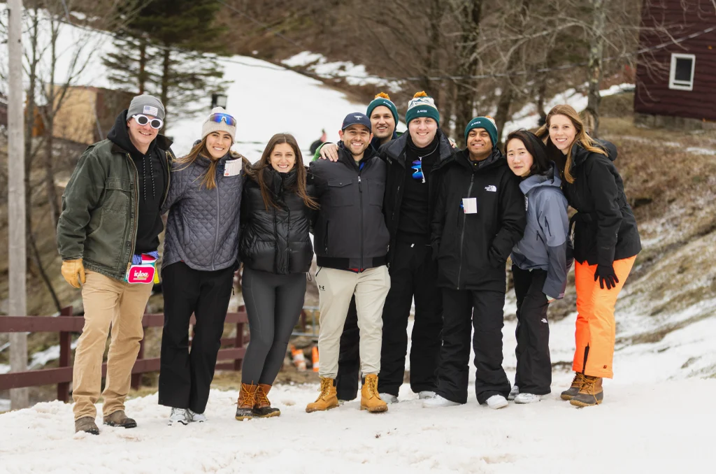 The Aker team in winter jackets on a snowy mountain trip