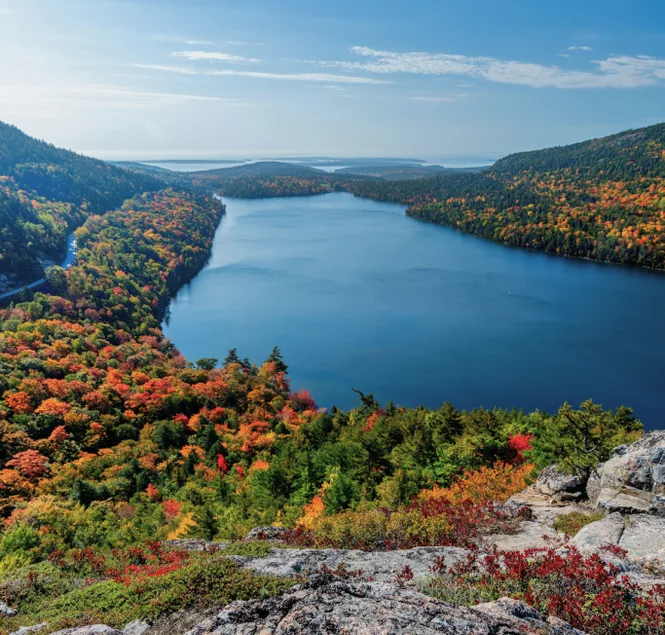 Mountain lake surrounded by autumn forest