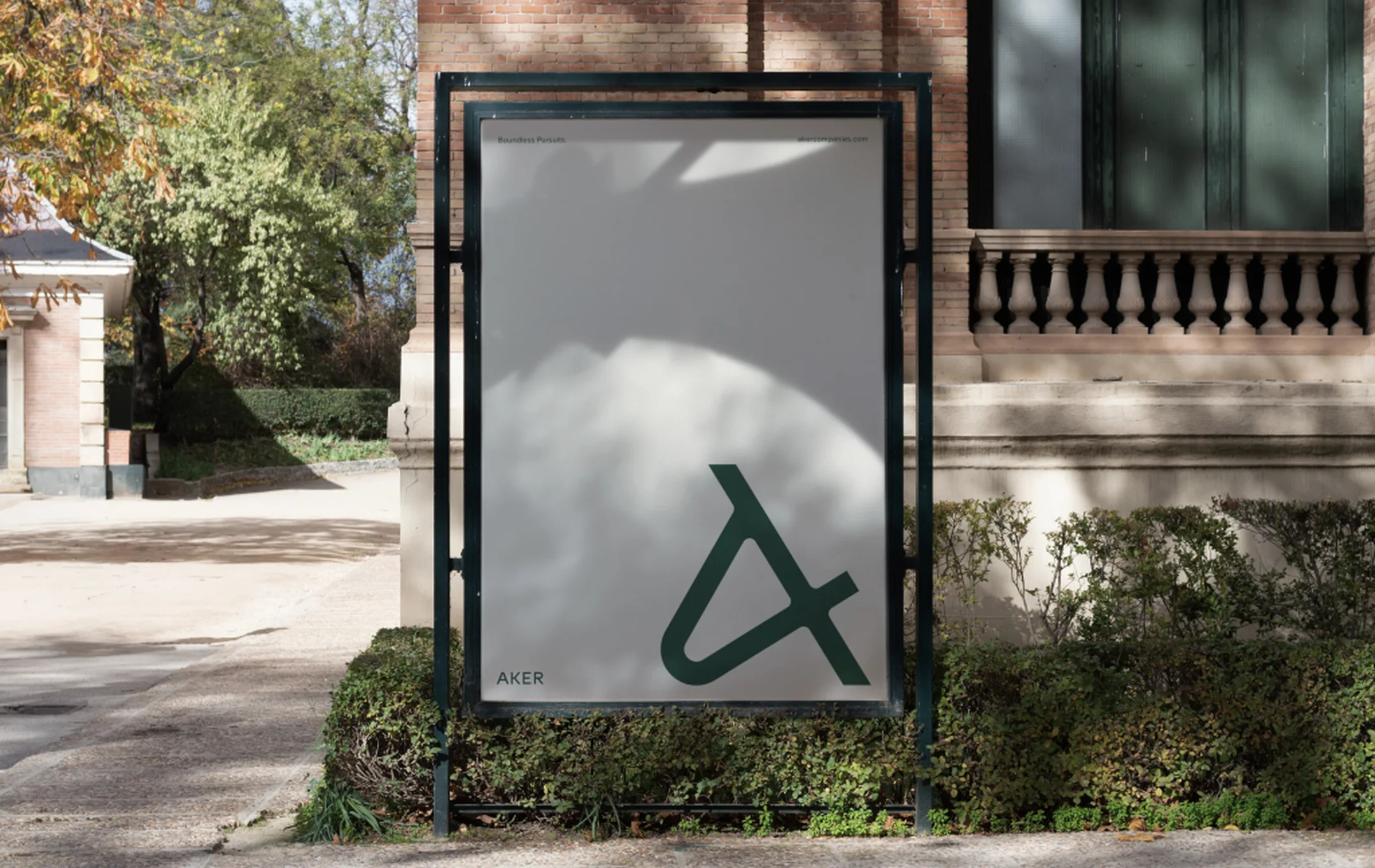 Aker poster with the Aker mark outside a historic building