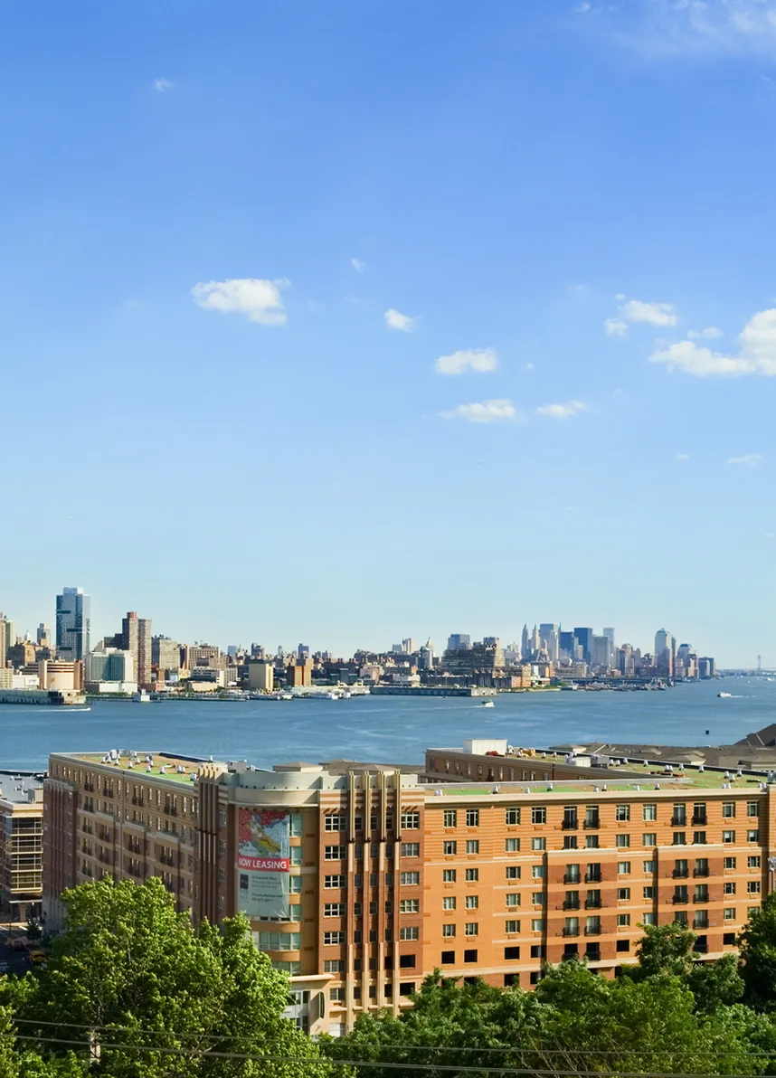 New York skyline seen across the river from a residential building