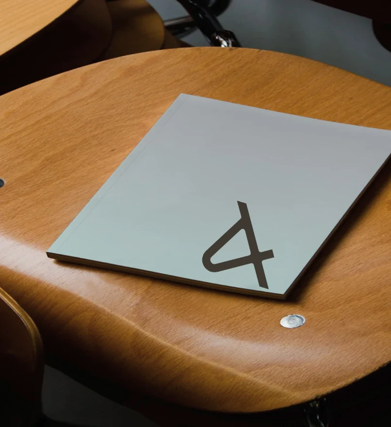 An Aker notebook on a wooden chair
