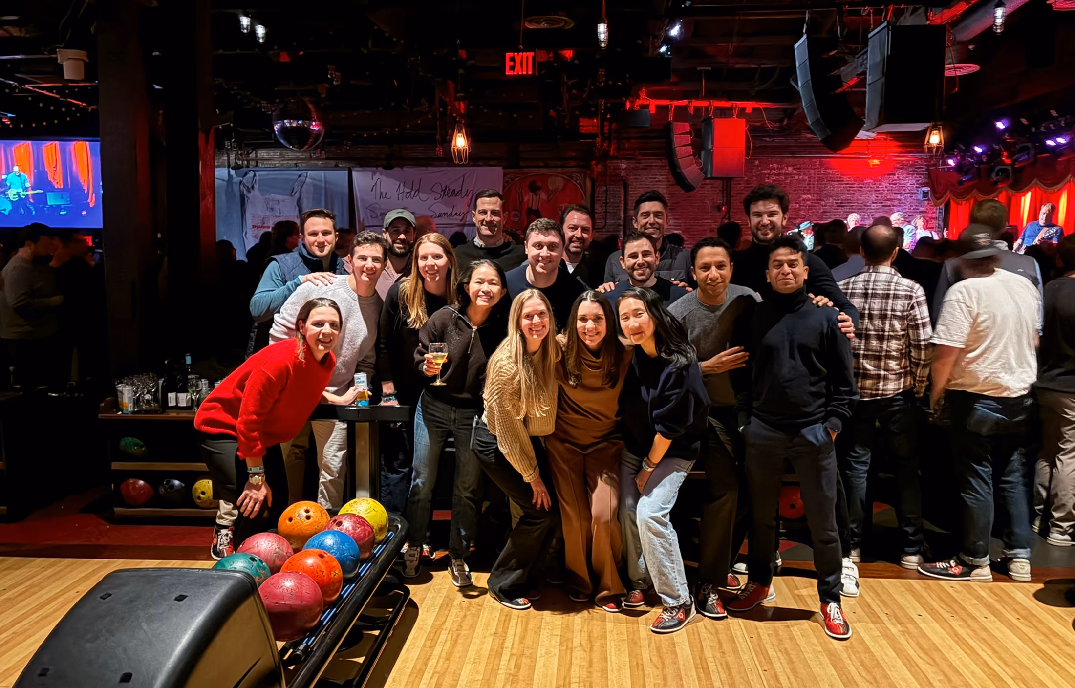 Colleagues snow tubing down a hill together