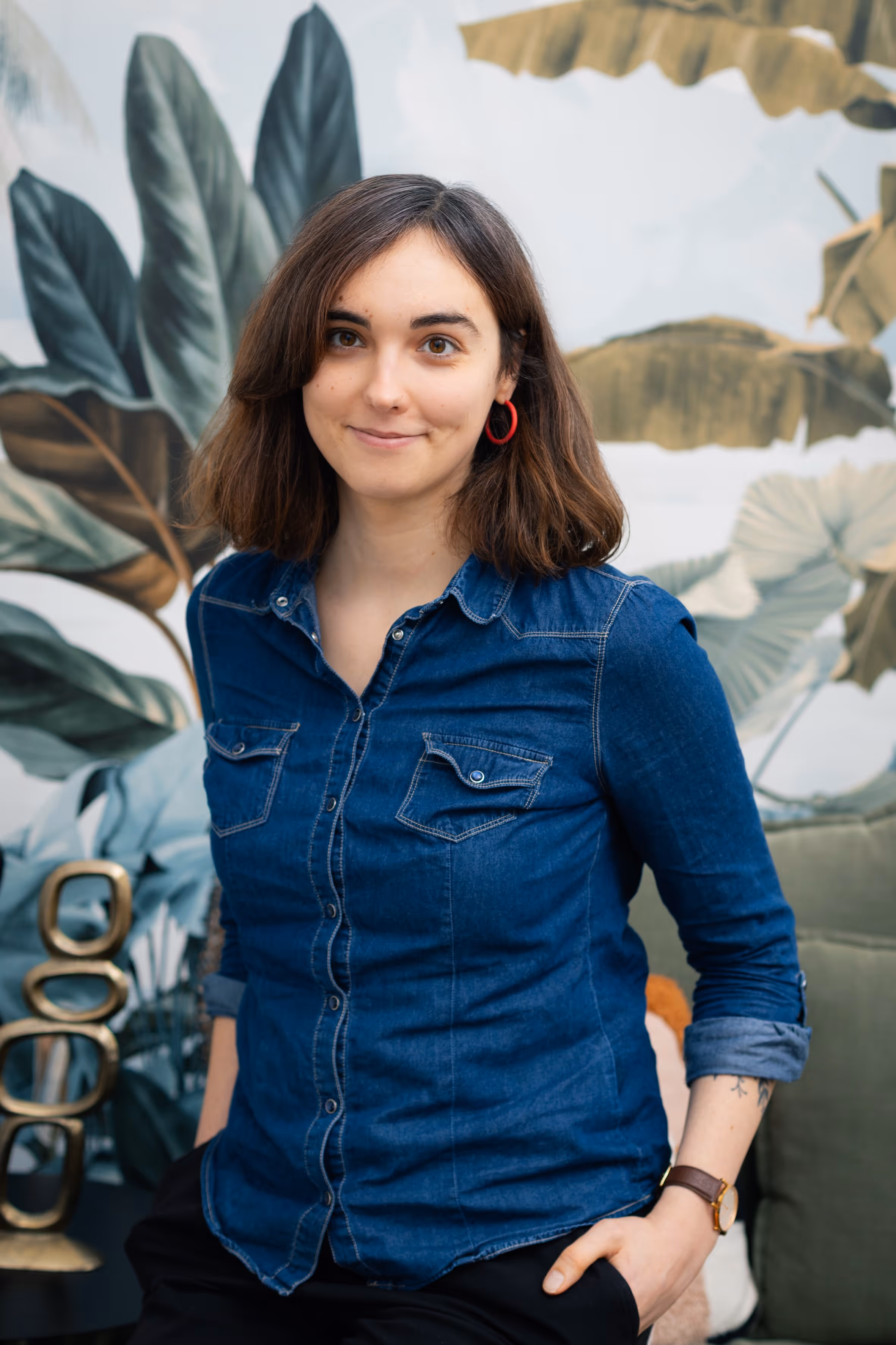 A portrait of a woman sitting and smiling.