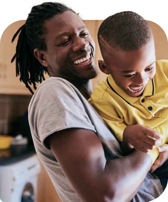 Dad and son embracing