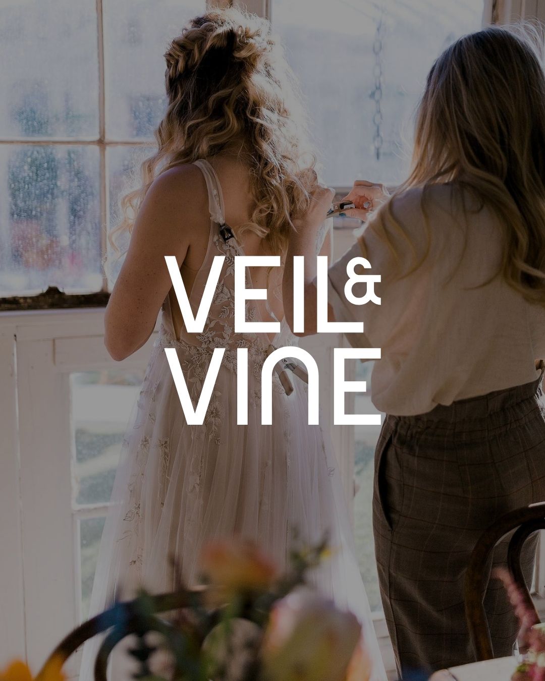 Veil and Vine wedding brand logotype over a bridal getting ready photograph